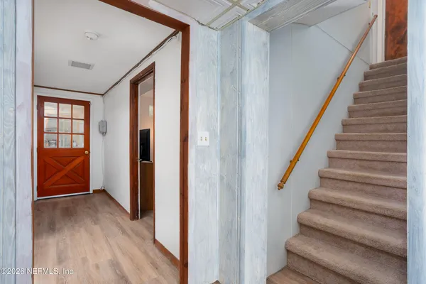 a view of a house with table and chairs