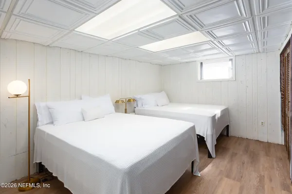 a view of a backyard with plants and patio