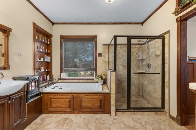 a large bathroom with a large tub and sink