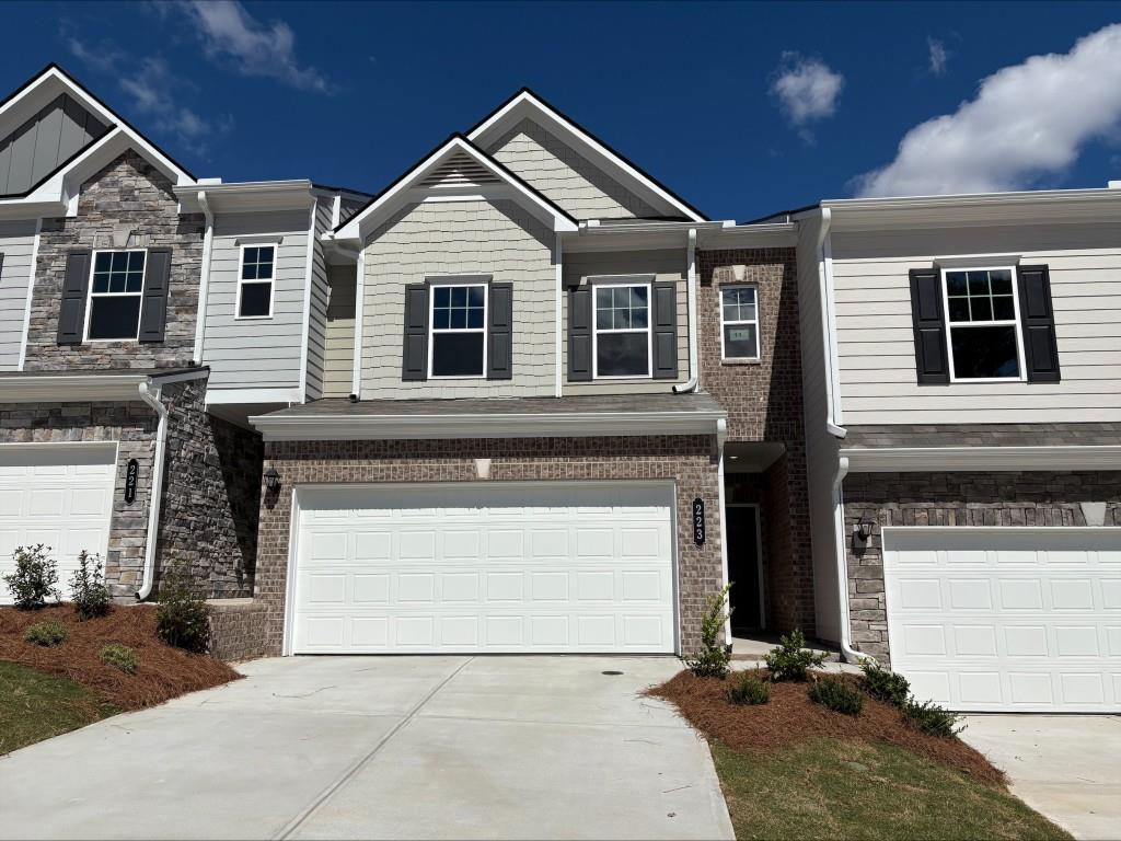 a front view of a house with a garage