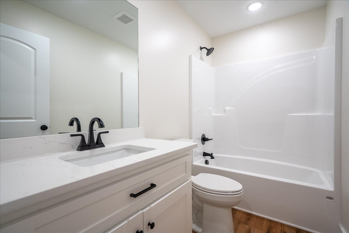 3987 Buffalo Road Summertown, TN 38483 - Photo 14 of 26 a bathroom with a sink a toilet and a bathtub