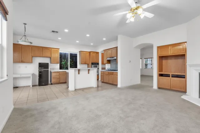 a view of kitchen with furniture and window
