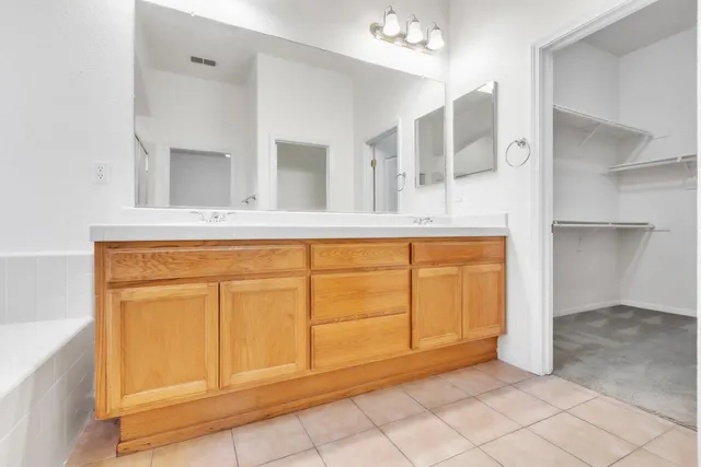 a view of a livingroom with wooden cabinets
