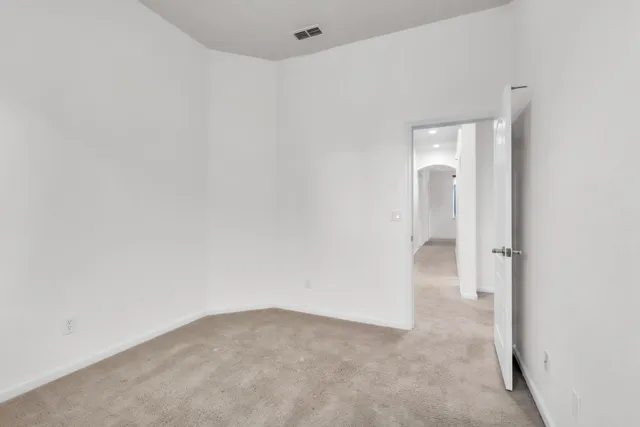 a bathroom with a toilet and a bath tub