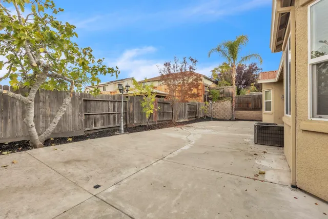 a view of house with backyard