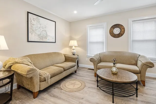 a living room with furniture and a rug