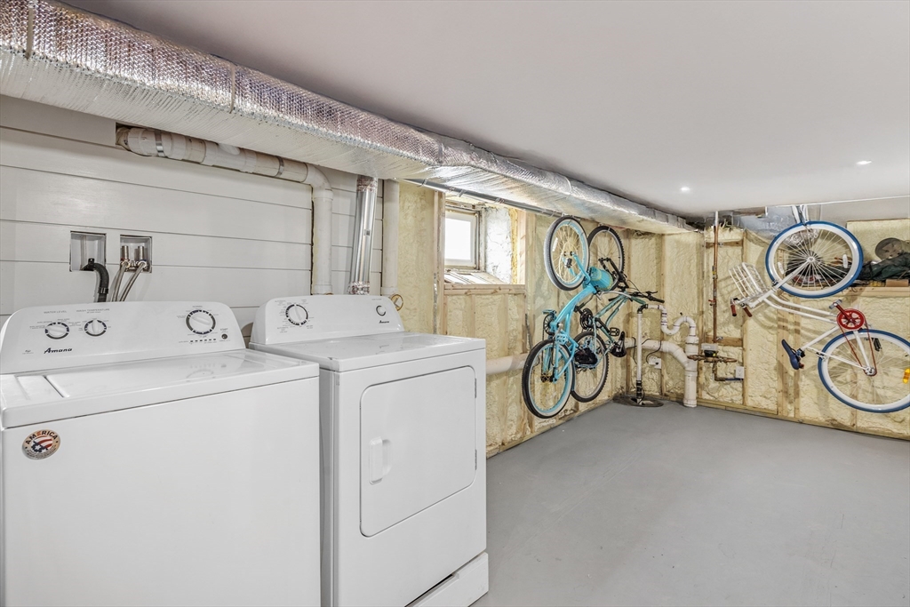 242 Atlantic Avenue, Unit 2 Hull, MA 02045 - Photo 19 of 21 a view of storage and utility room with washer and dryer
