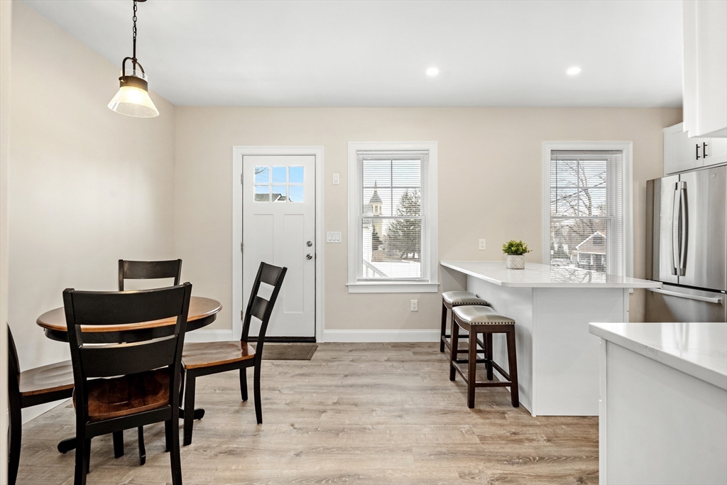 242 Atlantic Avenue, Unit 2 Hull, MA 02045 - Photo 6 of 21 a dining room with furniture and window