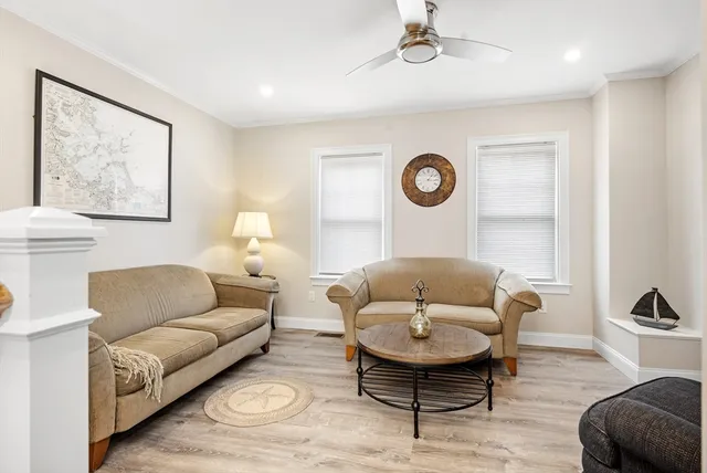 a living room with furniture and a rug