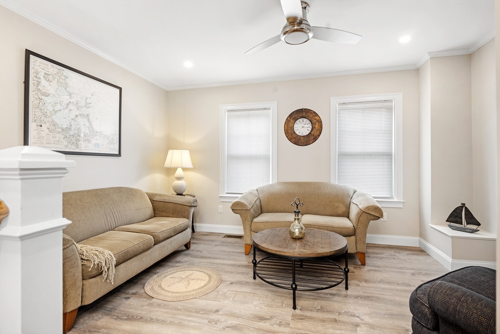 242 Atlantic Avenue, Unit 2 Hull, MA 02045 - Photo 9 of 21 a living room with furniture and a rug