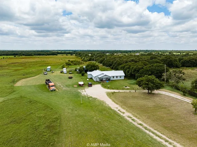 a view of a lake with a yard