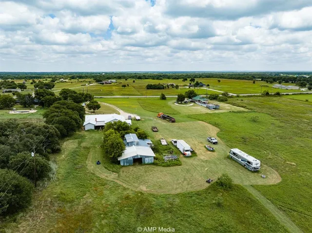 a view of a building and yard with trees