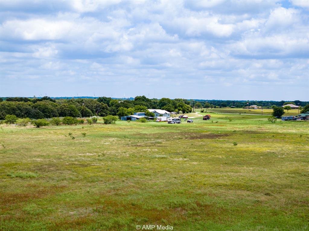 3255 Farm To Market 604 Clyde, TX 79510 - Photo 24 of 36 a view of a building and yard with trees