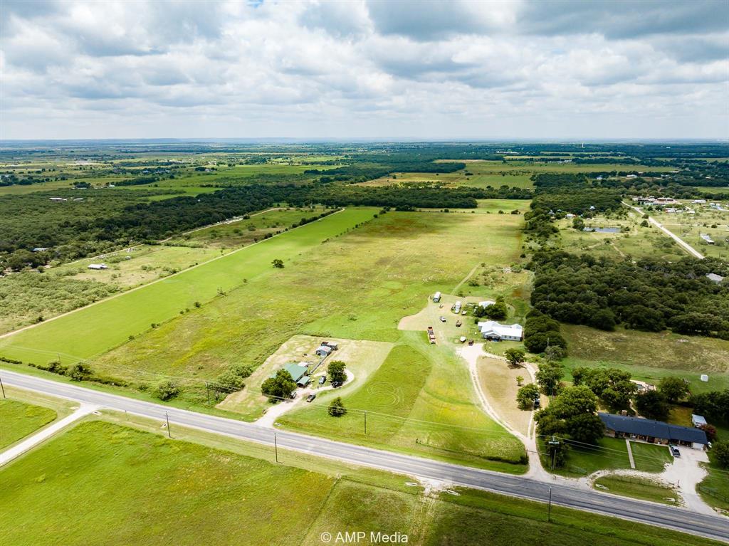 3255 Farm To Market 604 Clyde, TX 79510 - Photo 26 of 36 an aerial view of residential houses with outdoor space