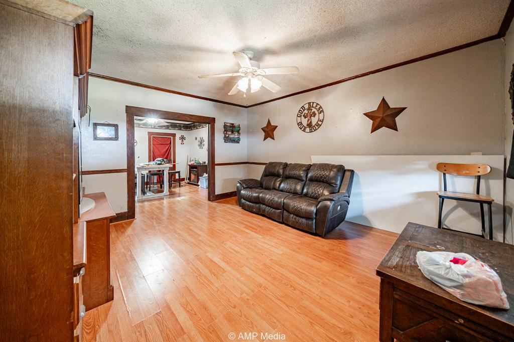 3255 Farm To Market 604 Clyde, TX 79510 - Photo 27 of 36 a living room with furniture and wooden floor