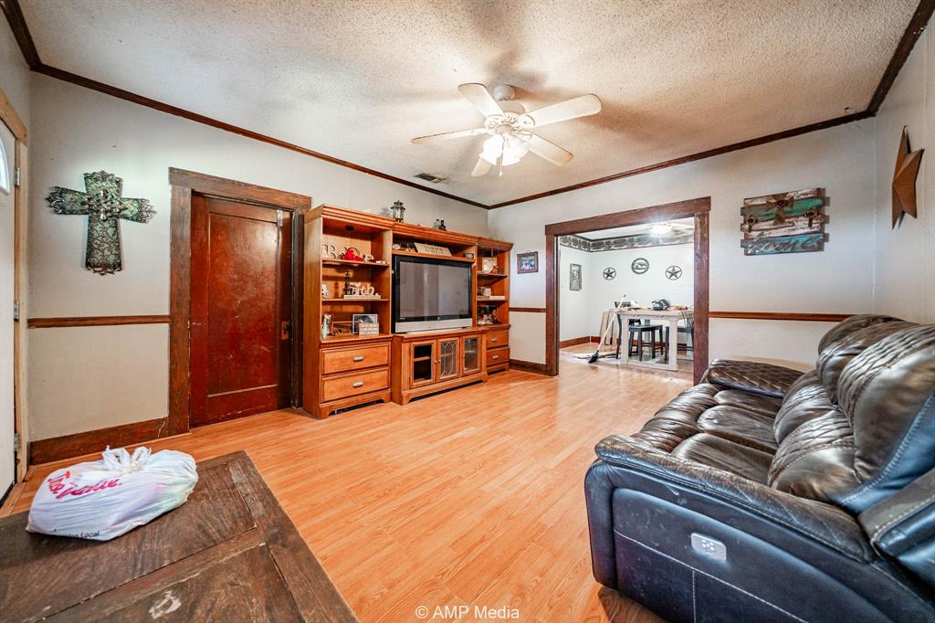 3255 Farm To Market 604 Clyde, TX 79510 - Photo 28 of 36 a living room with furniture and a flat screen tv