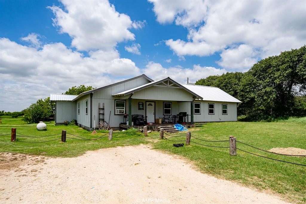 3255 Farm To Market 604 Clyde, TX 79510 - Photo 5 of 36 a front view of a house with garden
