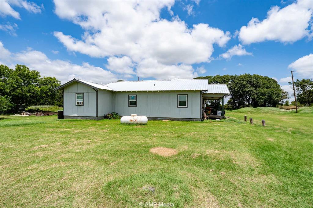 3255 Farm To Market 604 Clyde, TX 79510 - Photo 6 of 36 a view of a house with a yard