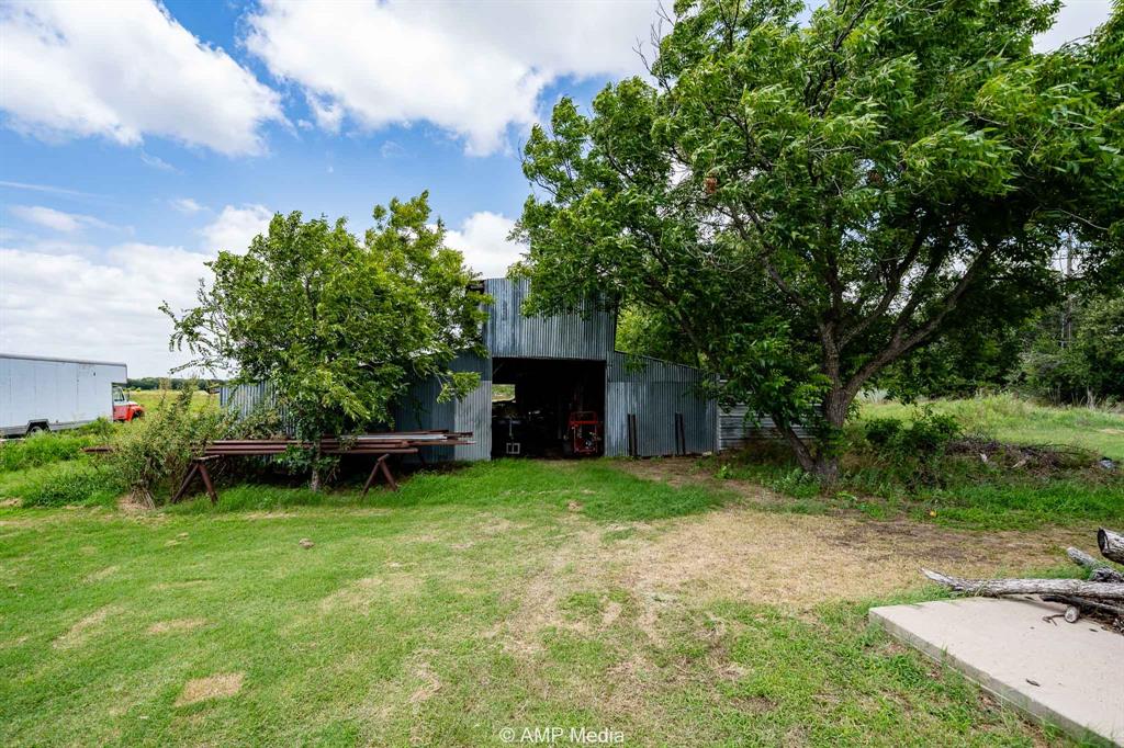 3255 Farm To Market 604 Clyde, TX 79510 - Photo 8 of 36 a backyard of a house with table and chairs