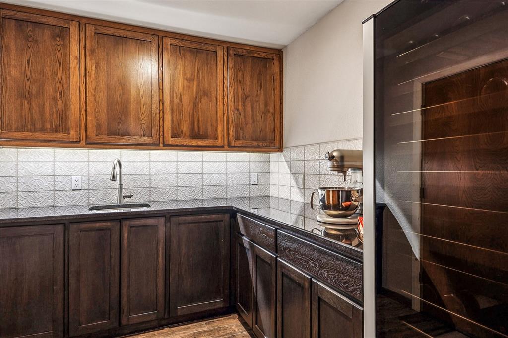 908 North Maple Street Muenster, TX 76252 - Photo 14 of 40 a kitchen with a sink and cabinets