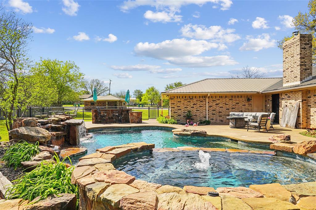 908 North Maple Street Muenster, TX 76252 - Photo 25 of 40 a view of a swimming pool with a patio
