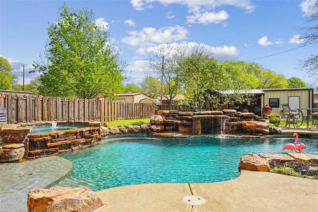 908 North Maple Street Muenster, TX 76252 - Photo 3 of 40 a view of a house with backyard and a slide