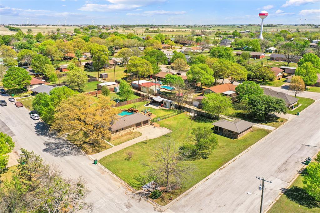 908 North Maple Street Muenster, TX 76252 - Photo 32 of 40 a view of a swimming pool with a yard