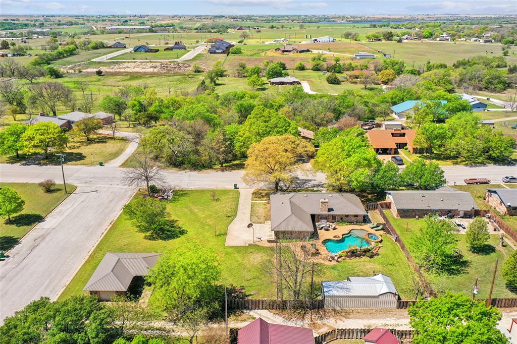908 North Maple Street Muenster, TX 76252 - Photo 34 of 40 an aerial view of residential houses with outdoor space