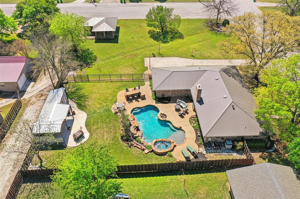 908 North Maple Street Muenster, TX 76252 - Photo 37 of 40 an aerial view of a house with outdoor space