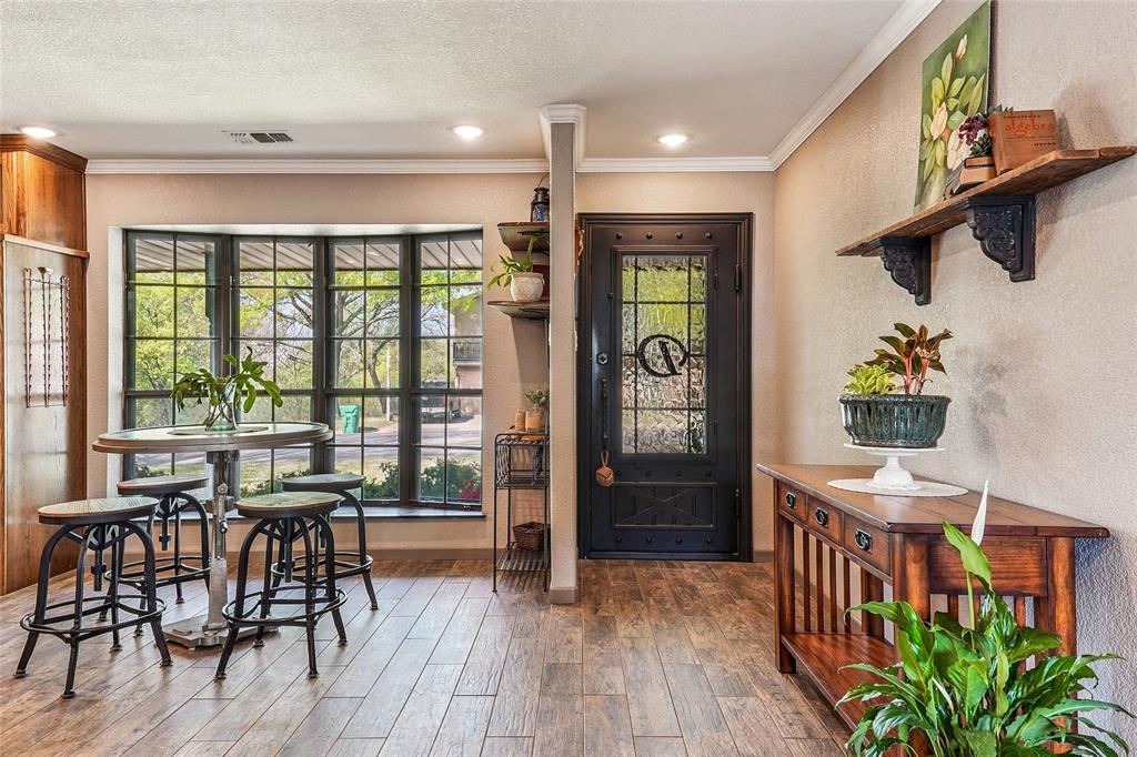 908 North Maple Street Muenster, TX 76252 - Photo 5 of 40 a view of a dining room with furniture window and wooden floor