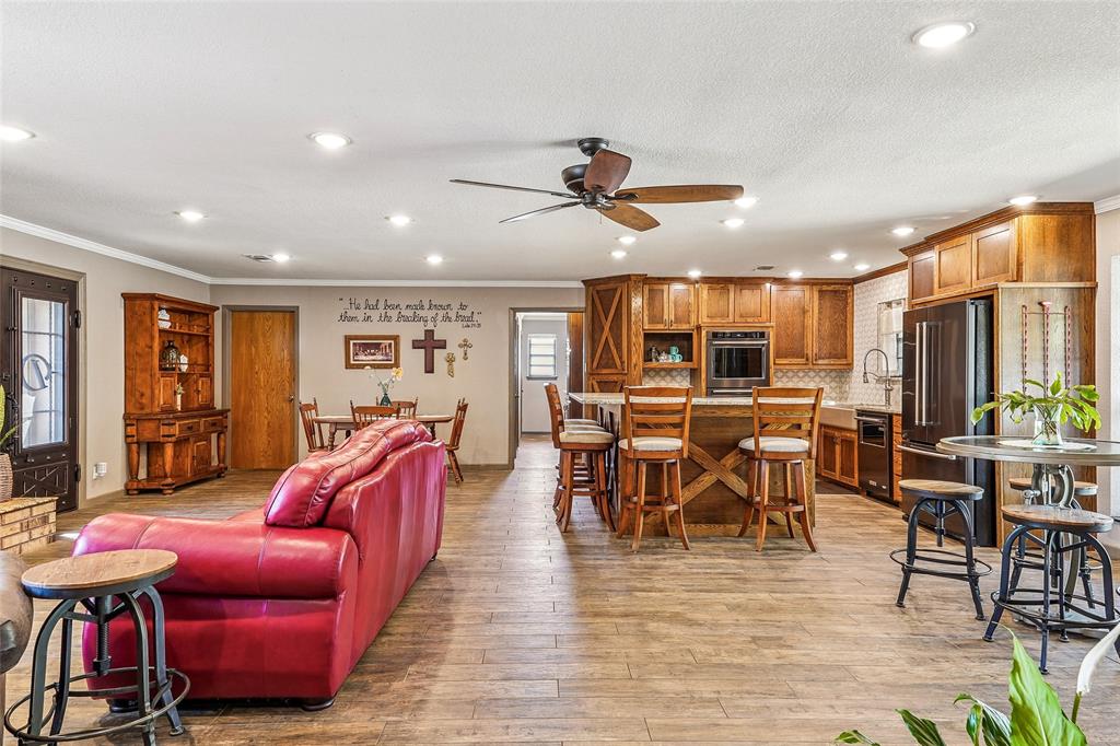 908 North Maple Street Muenster, TX 76252 - Photo 6 of 40 a view of a dining room with furniture window and wooden floor