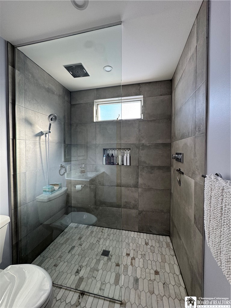 29 Loomis Bay Road Busti, NY 14710 - Photo 25 of 50 The walk-in shower is an ideal choice, complete wi