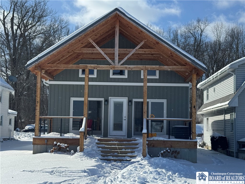 29 Loomis Bay Road Busti, NY 14710 - Photo 4 of 50 The view of the house from the lake showcases a la