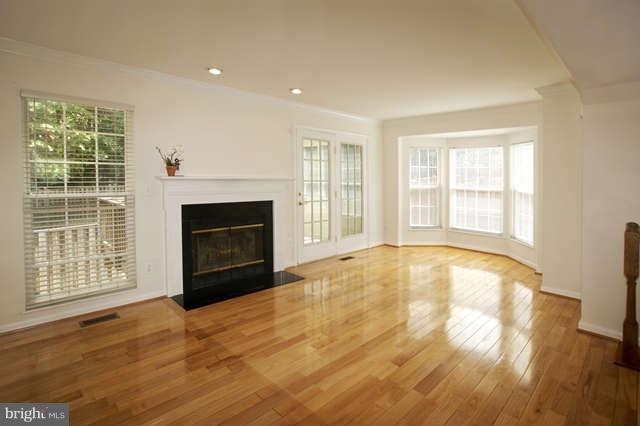 12846 Silvia Loop Woodbridge, VA 22192 - Photo 12 of 30 a view of an empty room with a fireplace and a window