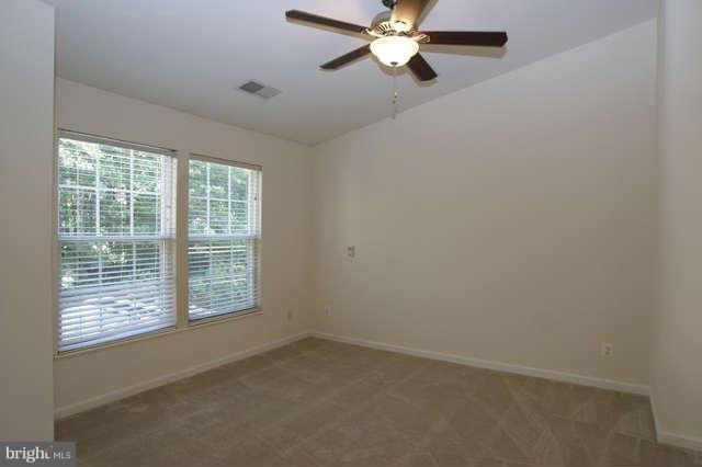 12846 Silvia Loop Woodbridge, VA 22192 - Photo 18 of 30 an empty room with a window and a fan