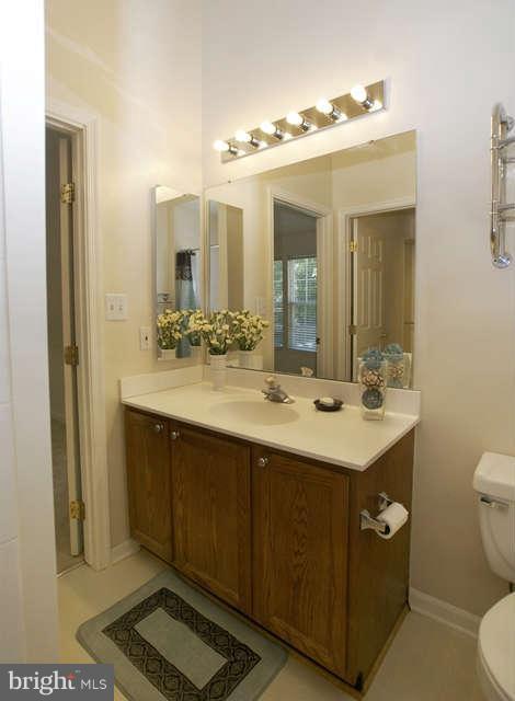 12846 Silvia Loop Woodbridge, VA 22192 - Photo 22 of 30 a bathroom with a sink double vanity and a mirror