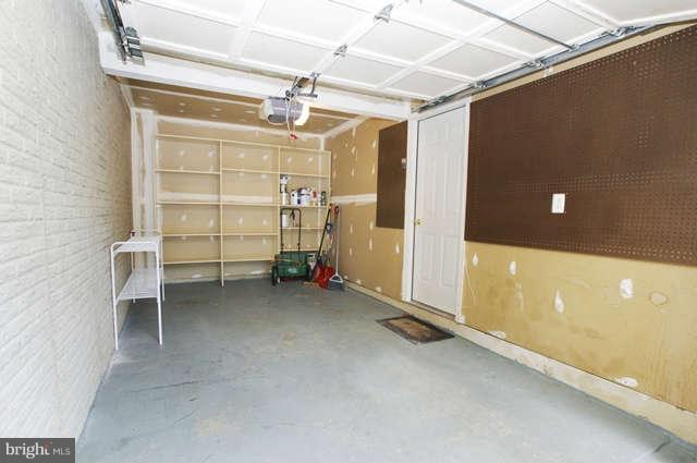 12846 Silvia Loop Woodbridge, VA 22192 - Photo 28 of 30 a view of a room with racks on the wall