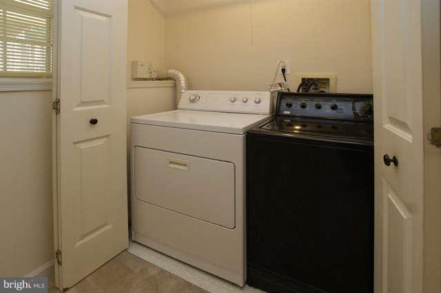 12846 Silvia Loop Woodbridge, VA 22192 - Photo 7 of 30 a utility room with dryer and washer