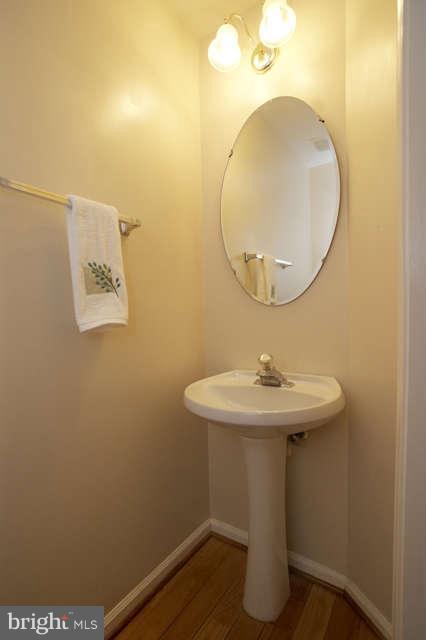 12846 Silvia Loop Woodbridge, VA 22192 - Photo 8 of 30 a bathroom with a sink and mirror