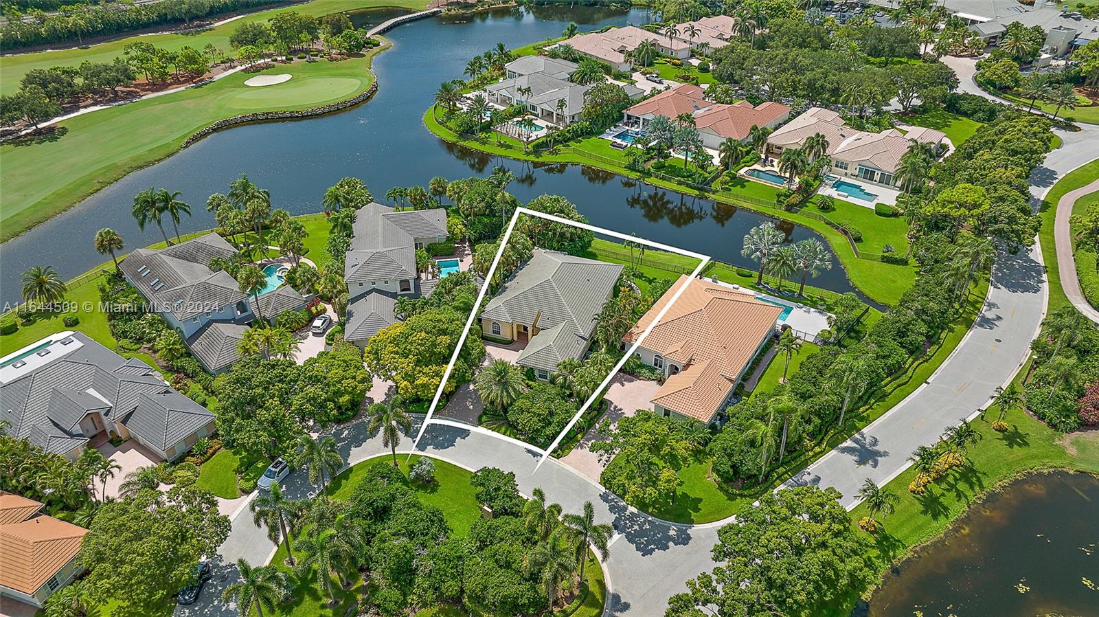 167 North Village Way Jupiter, FL 33458 - Photo 1 of 18 an aerial view of a house with a yard and lots of trees