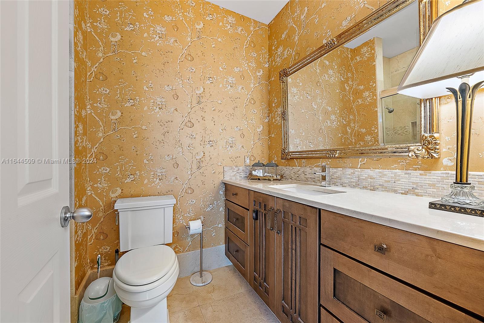 167 North Village Way Jupiter, FL 33458 - Photo 12 of 18 a bathroom with a granite countertop sink toilet and shower