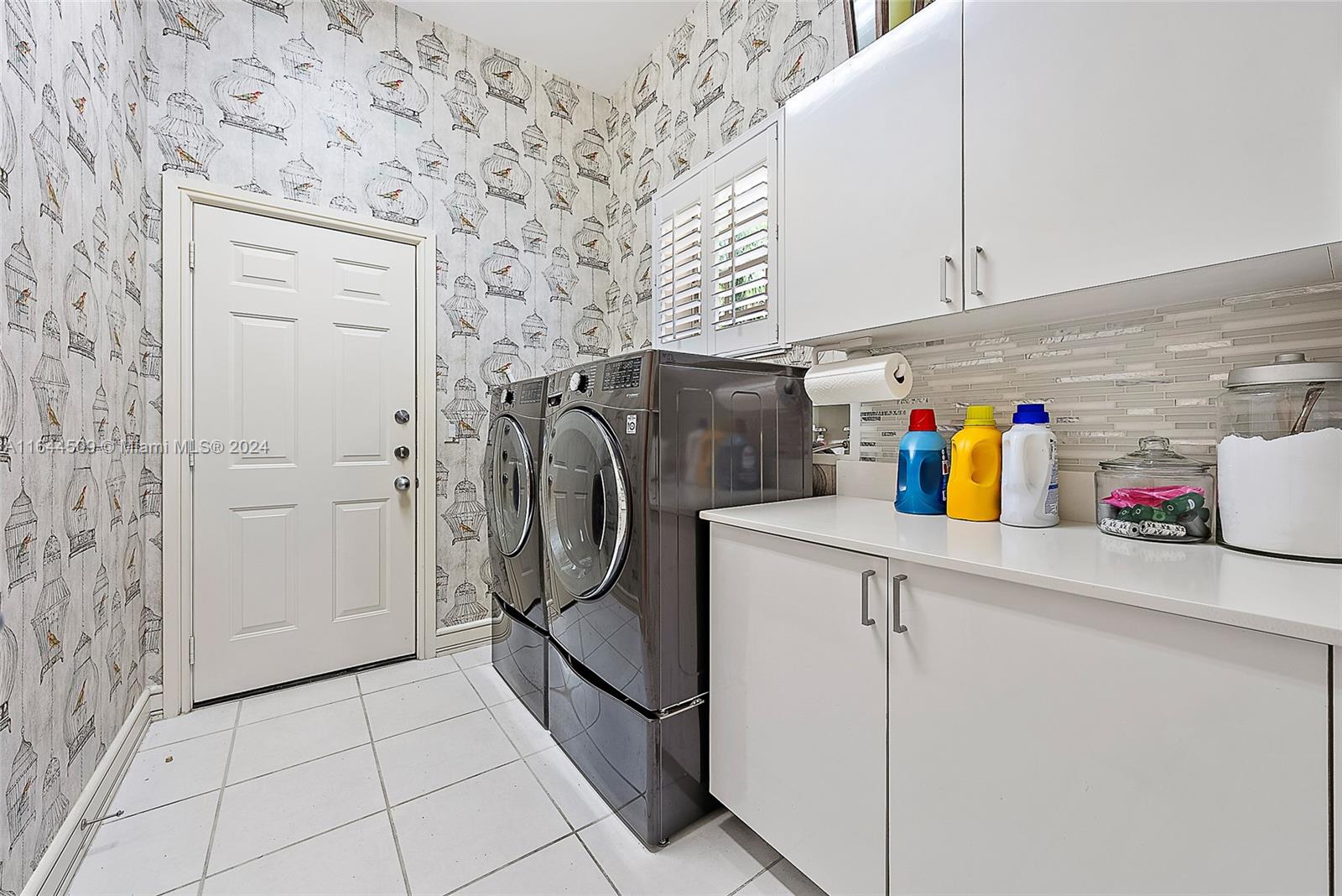 167 North Village Way Jupiter, FL 33458 - Photo 13 of 18 a utility room with dryer and washer