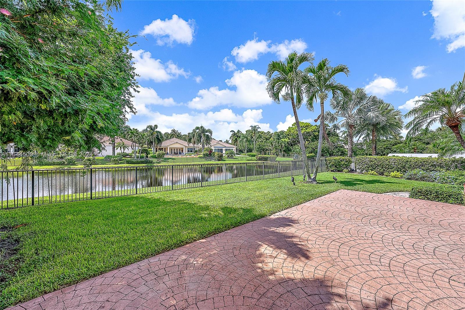 167 North Village Way Jupiter, FL 33458 - Photo 17 of 18 a view of a garden with a lake