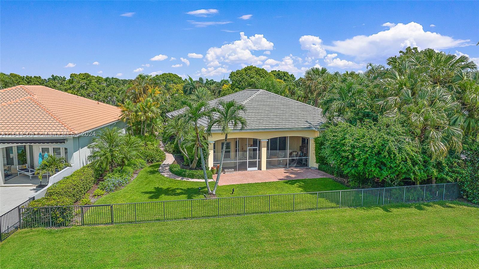 167 North Village Way Jupiter, FL 33458 - Photo 18 of 18 a view of a house with a yard and potted plants