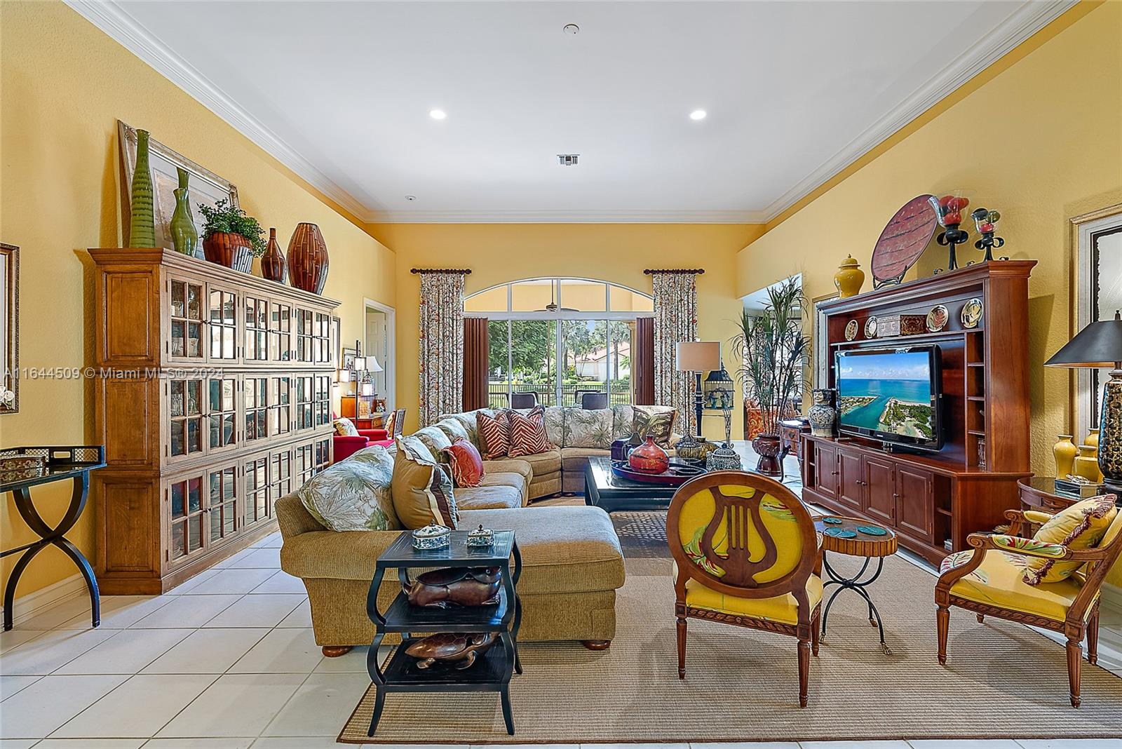 167 North Village Way Jupiter, FL 33458 - Photo 4 of 18 a living room with fireplace furniture and a flat screen tv