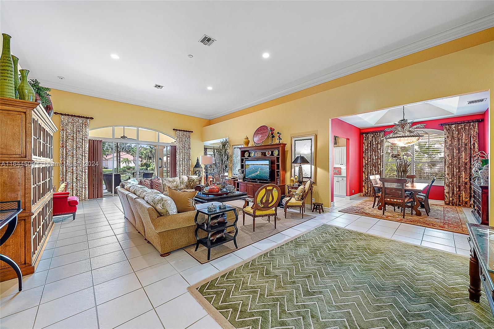 167 North Village Way Jupiter, FL 33458 - Photo 9 of 18 a living room with furniture a rug and a table