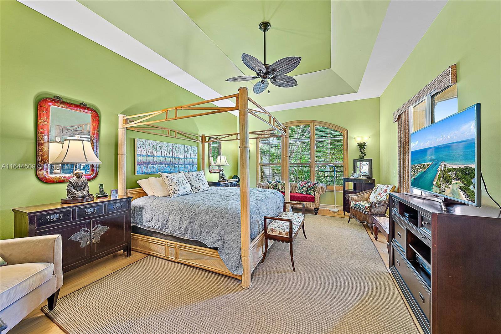 167 North Village Way Jupiter, FL 33458 - Photo 10 of 18 a bedroom with furniture and a chandelier