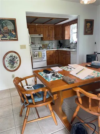 a open kitchen with a table and chairs
