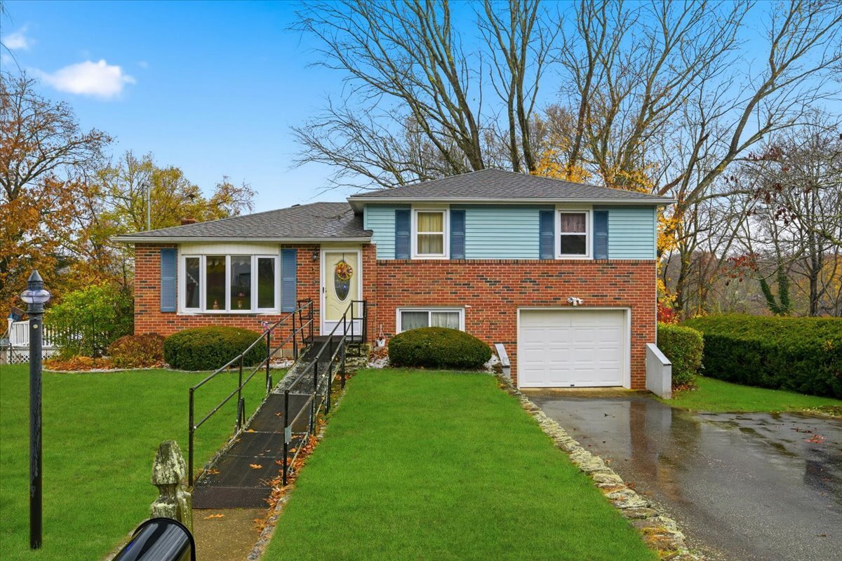 a front view of a house with garden