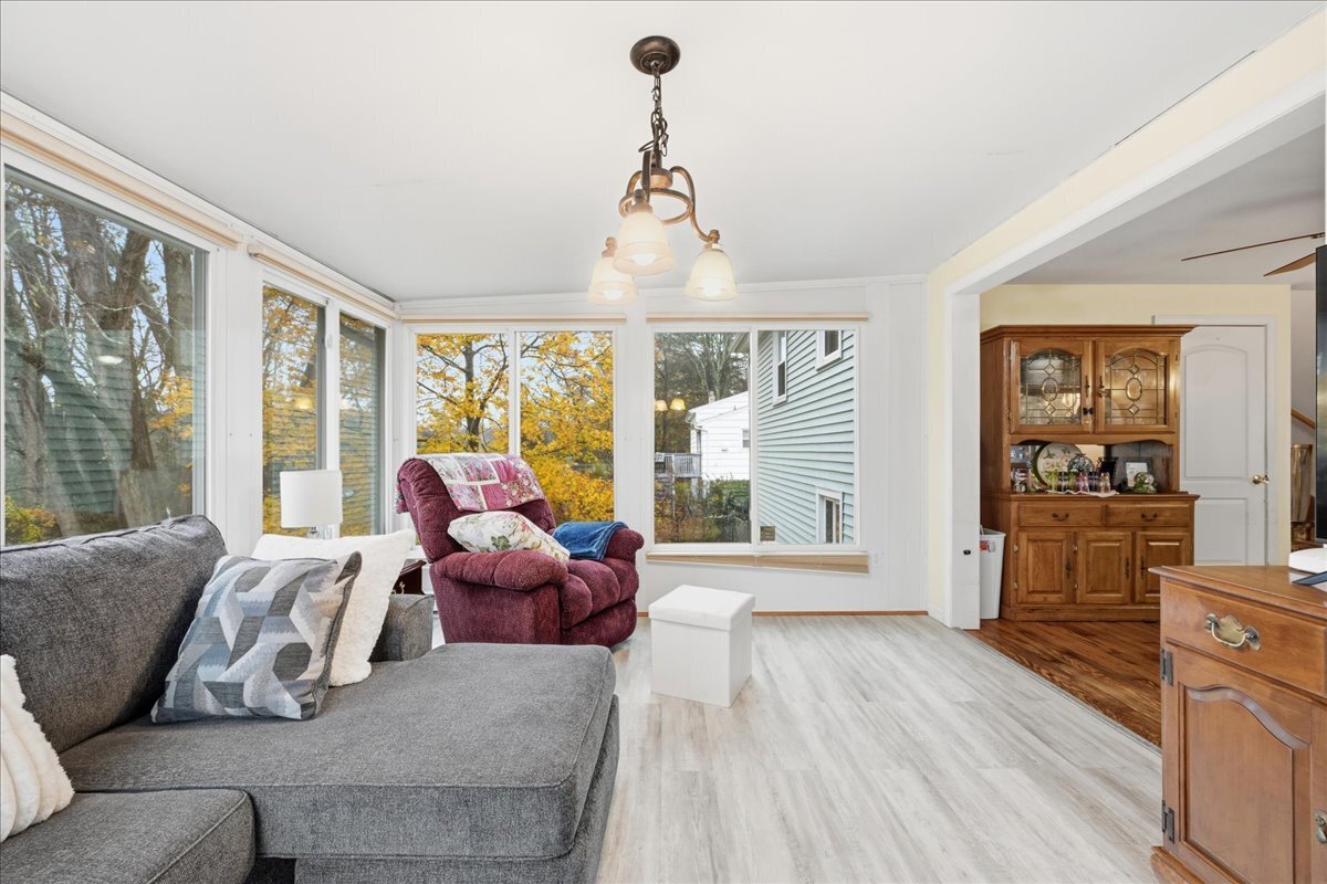 7 Barn Road Ledyard, CT 06339 - Photo 11 of 26 a living room with furniture and floor to ceiling windows